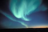 Aurora Borealis look like angels swooping down over arctic hills
