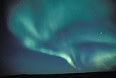 An ephemeral swirling patch of blue-green Aurora Borealis