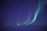 A gentle wave of Aurora Borealis in a twilight starry sky