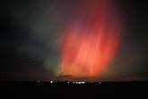 War of the gods, with spears of red Aurora Borealis in the night sky
