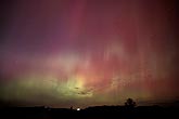 Patches and streaks of red, green and purple northern lights
