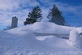A house buried by heavy snowpack after a heavy snow fall