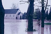 Flooding waters surround buildings