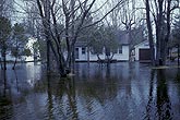 Shoreline flooding surrounds lakeside cottages