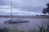 A vehicle stranded by a flash flood