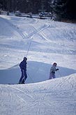 Skiers on a snow-covered ski slope