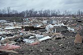 Extreme damage and devastation with debris fragments from a tornado