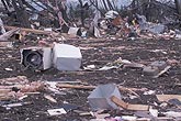 Tornado debris field with sinks, appliances and clothing