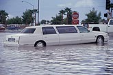 Stretch limousine in flooding after a severe storm in floods city streets