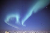Swirling bands of northern lights (Aurora Borealis) in arctic twilight