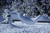 A close-up of a snow garland, sculpted and twisted by wind