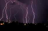 Finely etched multiple lightning strikes in an inky sky