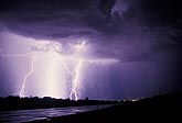 Brilliant lightning under a dark threatening cloud