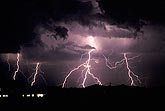 Hairy cloud-to-ground lightning bolts light up a stormy sky