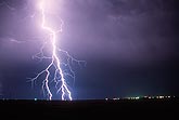 A single highly electric forked lightning bolt strikes