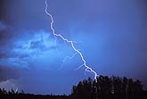 A bolt from the blue, as a close cloud-to-ground lightning bolt strikes