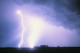 A power bolt of lightning blasts the sky with blinding light