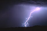 A single colorful power lightning bolt strikes