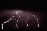 Bright cloud-to-ground lightning strikes threaten the sleeping 
