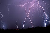 Close cloud-to-ground lightning with multi-colored filaments
