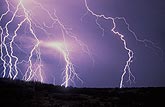 Highly detailed cloud-to-ground lightning bolts spark and flash