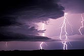 Close-up of jagged lightning bolts with brooding storm clouds