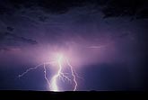 Mystery: a forked highly electric lightning bolt fogged by rain