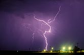 A wild and crazy erratic single lightning strike over city lights