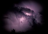 Subtle in-cloud lightning illuminates a storm cloud