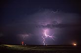 Distant lightning flash with irregular structure and spritzes of filaments