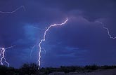 A brilliant cloud-to-ground lightning bolt strikes fear