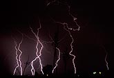 Multiple knotted lightning bolts in the night sky