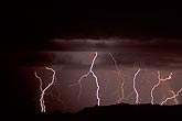 Gold and silver lightning with filagree filaments in the mountains