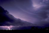 Lightning illuminates an Arcus cloud at night
