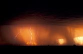Sky on fire with lightning and rain in red sky