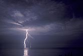 Cloud-to-ground lightning over water