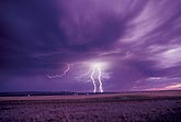 Brilliant cloud-to-ground lightning strikes in waning daylight
