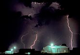 Lightning strikes around a garage in a town