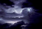 Ghostly silhouettes from lightning behind clouds