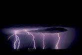 Lightning bolts strike from dark clouds