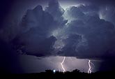 Cloud types, Cb: Cumulonimbus clouds at night with lightning