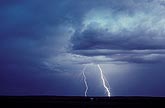 Cloud-to-ground lightning discharge with powder-blue lighting
