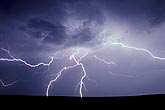 A burst of lightning spreads in opposite directions