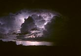 Cumulonimbus storm cloud with intracloud lightning (in-cloud)