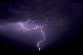 A looped and jagged lightning discharge with fine hairy branches