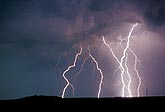 A cluster of highly electric cloud-to-ground lightning bolts