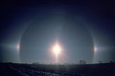 Pair of sundogs, or mock suns, in a halo around the morning sun