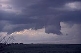 Close view of an incomplete cloud lowering under an updraft 