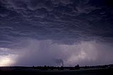 Underneath a thunderstorm cloud with a large updraft base