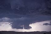 Close-up of partial wall cloud showing fragmented low clouds